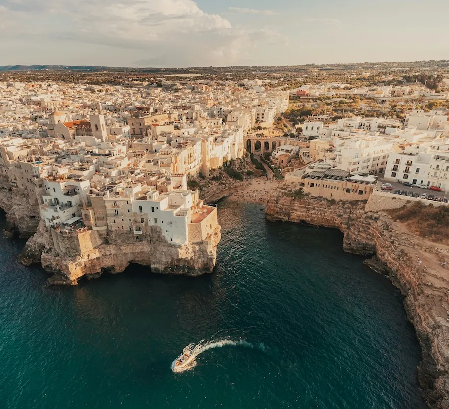 Sunset over the whitewashed cliffside town of Polignano a Mare, Puglia